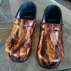 Dansko Tiger Eyes Patent Leather Clogs